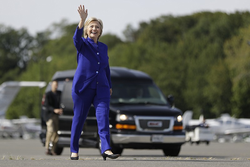 Democratic presidential candidate Hillary Clinton waves as she walks to her campaign plane at Westchester County Airport in White Plains, N.Y., last week.