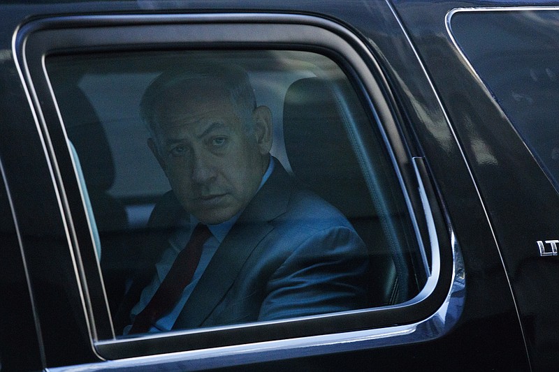 Israeli Prime Minister Benjamin Netanyahu leaves in his vehicle after a meeting with Republican presidential candidate Donald Trump at Trump Tower, Sunday, Sept. 25, 2016, in New York. (AP Photo/ Evan Vucci)