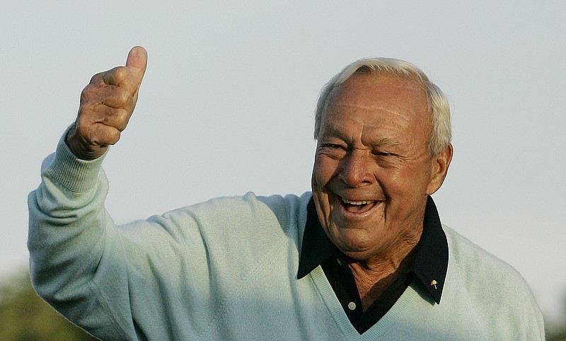 This April 5, 2007, file photo shows former Masters champion Arnold Palmer acknowledging the crowd after hitting the ceremonial first tee shot prior to the first round of the 2007 Masters golf tournament at the Augusta National Golf Club in Augusta, Ga. Palmer, who made golf popular for the masses with his hard-charging style, incomparable charisma and a personal touch that made him known throughout the golf world as "The King," died Sunday, Sept. 25, 2016, in Pittsburgh. He was 87. (AP Photo/David J. Phillip, File)