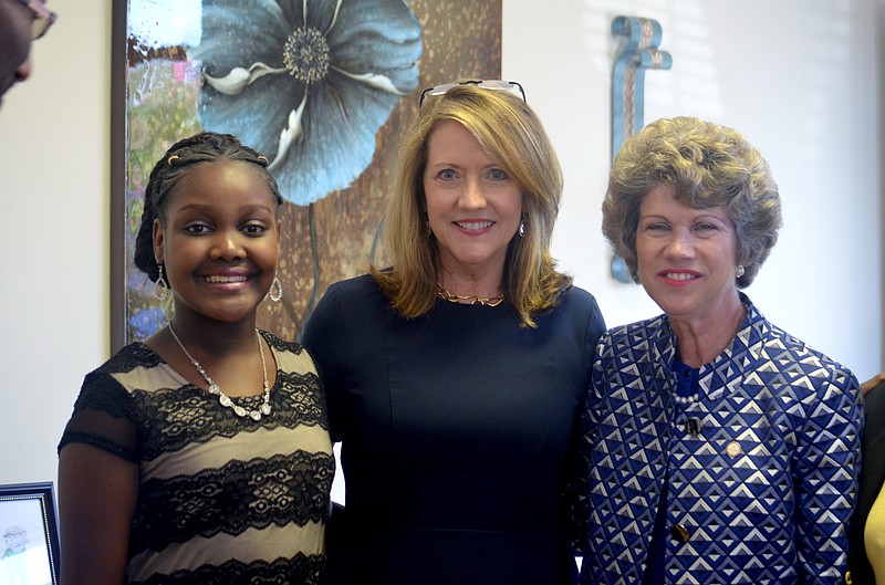 
              In this Wednesday, Sept. 21, 2016 photo, from left to right, author Robyn Gordon, Tennessee first lady Crissy Haslam and Clarksville Mayor Kim McMillan pose after wrapping up a reading session with students of Power and Grace Preparatory Academy, in Clarksville, Tenn. (Pranaav Jadhav  /The Leaf-Chronicle via AP)
            