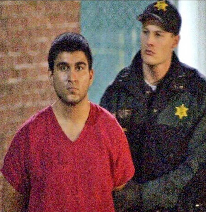 
              This late Saturday, Sept. 24, 2016, image from video by KIRO7 photographer Jeff Ritter shows suspected Cascade Mall shooter Arcan Cetin at Skagit County Jail in Mount Vernon, Wash., after his arrest in Oak Harbor, Wash., earlier in the evening. Investigators on Sunday tried to piece together information on the 20-year-old suspect in the deadly Washington state mall shootings who was apprehended after a nearly 24-hour manhunt. (Jeff Ritter/KIRO7.com via AP)
            