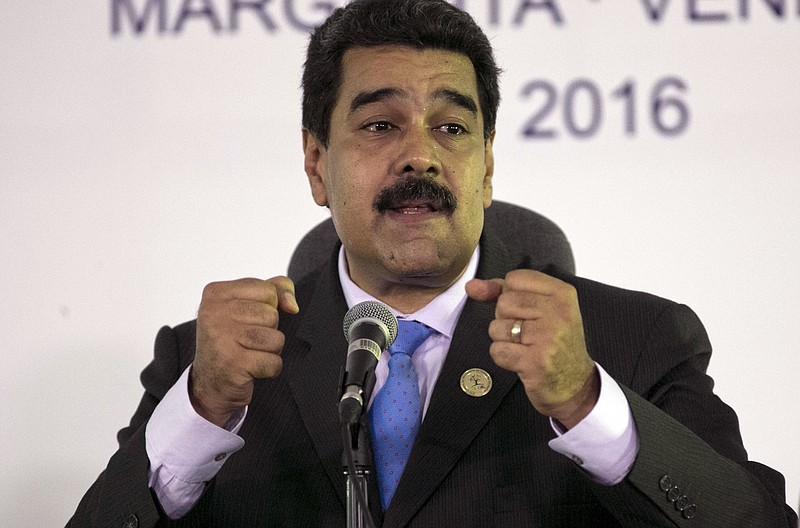 
              FILE - In this Sept 18, 2016, file photo, Venezuela's President Nicolas Maduro speaks during a press conference after closing ceremony of the 17th Non-Aligned Movement Summit in Porlamar, on Venezuela's Margarita Island. In Venezuela two-thirds of voters say in polls they want President Nicolas Maduro gone amid worsening shortages and inflation. (AP Photo/Ariana Cubillos, File)
            