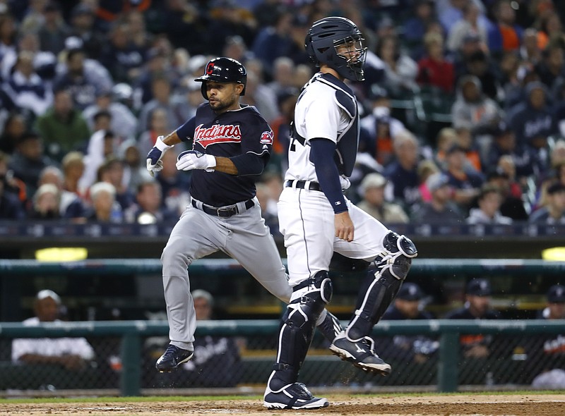 
              Cleveland Indians' Coco Crisp scores as Detroit Tigers catcher James McCann waits for the throws on a Roberto Perez single during the eighth inning of a baseball game in Detroit, Monday, Sept. 26, 2016. (AP Photo/Paul Sancya)
            
