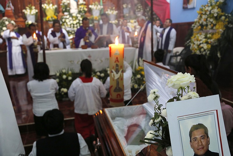 
              This Sept. 21, 2016 photo shows the funeral Mass for slain Rev. Jose Alfredo Suarez de la Cruz at Our Lady of Asuncion Church in Paso Blanco, Veracruz state, Mexico, his hometown. Church leaders are increasingly frustrated by authorities’ inability to protect their priests under Mexican President Enrique Pena Nieto’s administration. (AP Photo/Marco Ugarte)
            