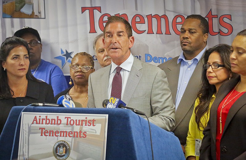 
              N.Y. State Senators Jeff Klein, center, and Diane Savino, far left, are joined by local residents during a press conference to announce a legislative housing code proposal for Airbnb, Monday Sept. 26, 2016, in New York. (AP Photo/Bebeto Matthews)
            