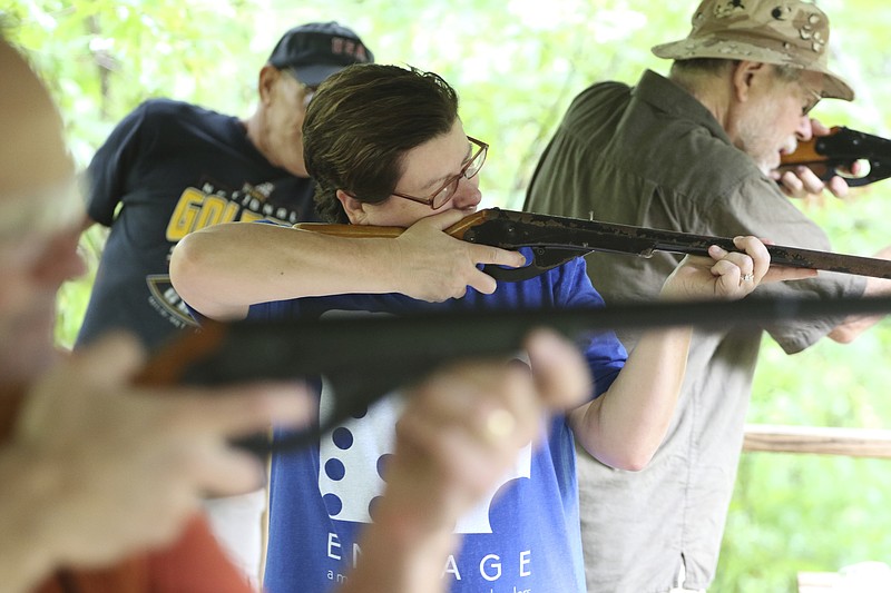 Tanya Mazzolini shoots BB guns with other participants during the Adult Adventure Camp & Retreat at Camp Ocoee.