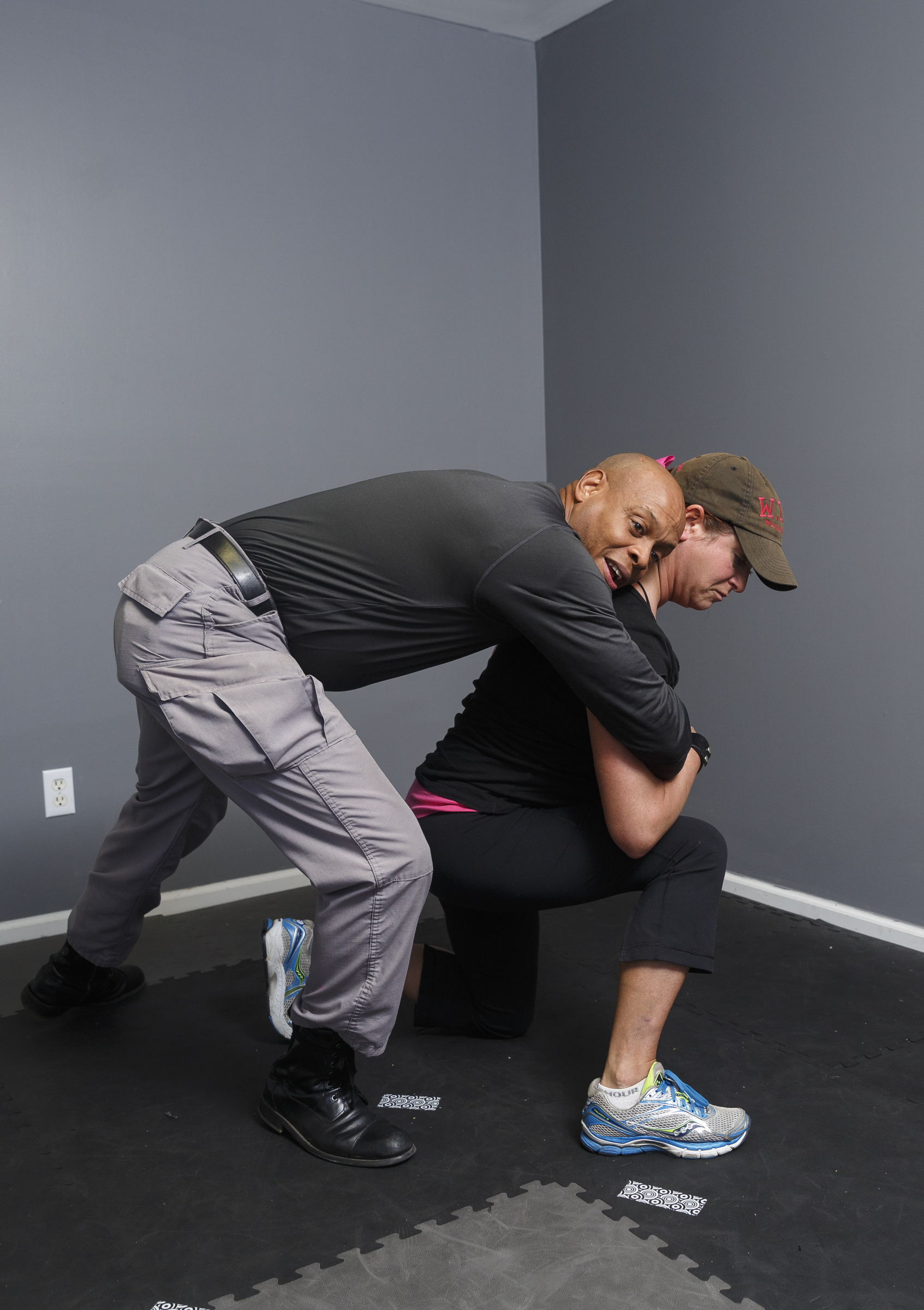 3. Lunge one leg forward and drop to one knee. Unable to control your weight, the attacker will be pulled down with you.