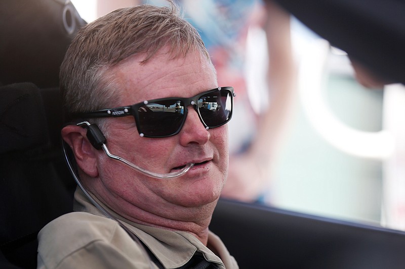 
              Indy Racing League driver Sam Schmidt prepares to drive his modified Corvette on Tuesday, Sept. 27, 2016, in Las Vegas. Schmidt was paralyzed from the neck down in a crash 16 years ago. His car uses four cameras to monitor his head and transmit his movements to the tires. He breathes into a tube to accelerate and sucks the air out when he wants to brake. (AP Photo/Isaac Brekken)
            