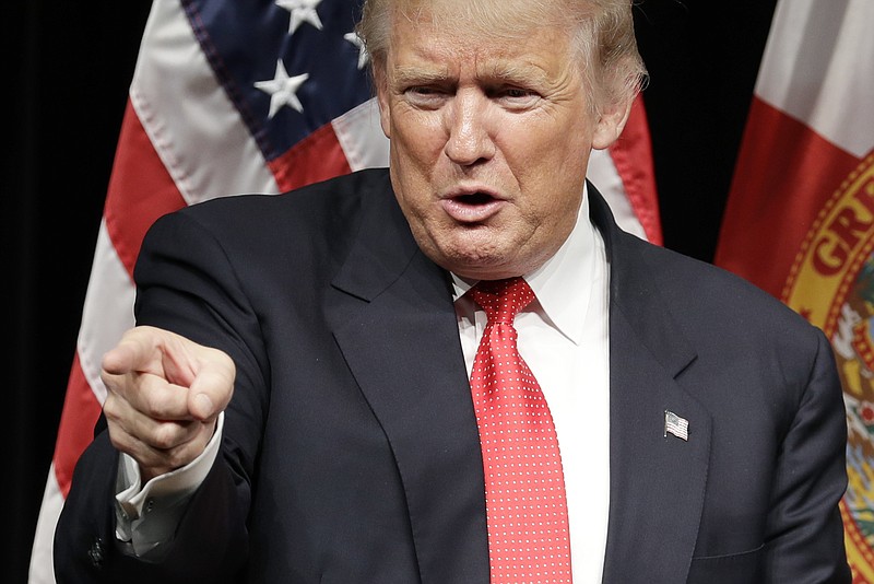 
              Republican presidential candidate Donald Trump speaks at a roundtable event, Tuesday, Sept. 27, 2016, in Miami. (AP Photo/John Locher)
            