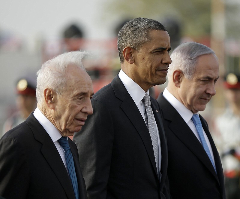 
              FILE - In this March 22, 2013, file photo, President Barack Obama walks on the tarmac with Israeli Prime Minister Benjamin Netanyahu, right, and Israeli President Shimon Peres, left, prior to his departure from Ben Gurion International Airport in Tel Aviv.  Shimon Peres, a former Israeli president and prime minister, whose life story mirrored that of the Jewish state and who was celebrated around the world as a Nobel prize-winning visionary who pushed his country toward peace, has died, the Israeli news website YNet reported early Wednesday, Sept. 28, 2016. He was 93. (AP Photo/Pablo Martinez Monsivais, File)
            