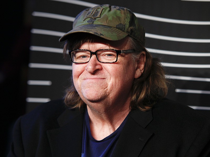 
              FILE - In this May 16, 2016 file photo, Michael Moore attends the 20th Annual Webby Awards at Cipriani Wall Street in New York. Moore says he's not allowed to perform a one-man show about the presidential race at a central Ohio theater because officials there consider him too controversial. Moore says he will go ahead with his plans for the show at an undisclosed site in southern Ohio in Oct. 2016. (Photo by Andy Kropa/Invision/AP, File)
            