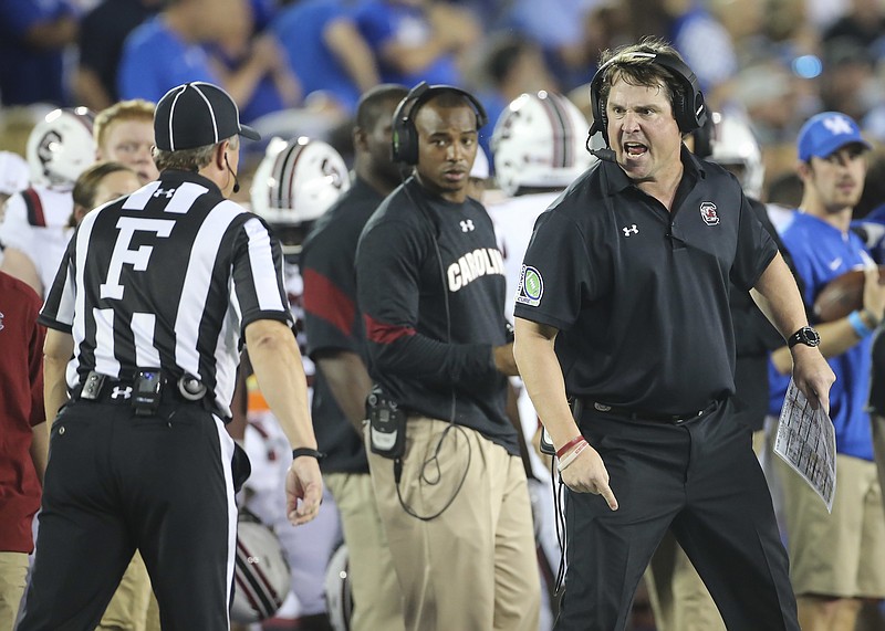 South Carolina's Will Muschamp, right, is among the SEC football coaches who questioned the wisdom of LSU firing Les Miles during the season. Muschamp was fired in his fourth year at Florida with two games to play but was allowed to finish the season.