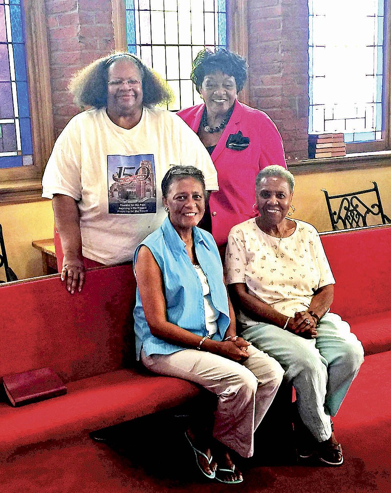 Members of the First Baptist Church on E. 8th Street are celebrating the church's 150th anniversary. Members pictured are, back row, from left, Janis Kennedy and Anne McGintis. Front row, from left, Yvonne Beard and Wynona H. McGhee.
