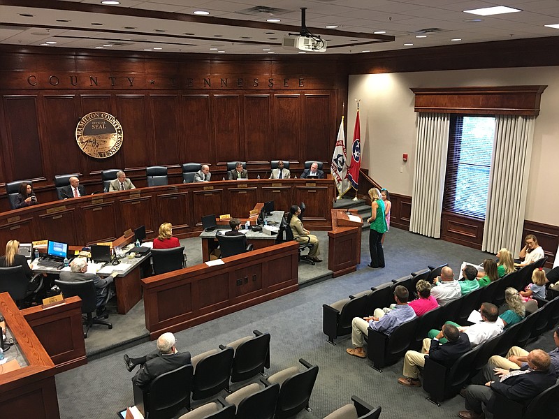 Ashlie Henderson, vice president of East Hamilton School's fundraising body, and student Anna Kate Stewart speak to Hamilton County commissioners about the lack of permanent restrooms at the school's athletic complex.
