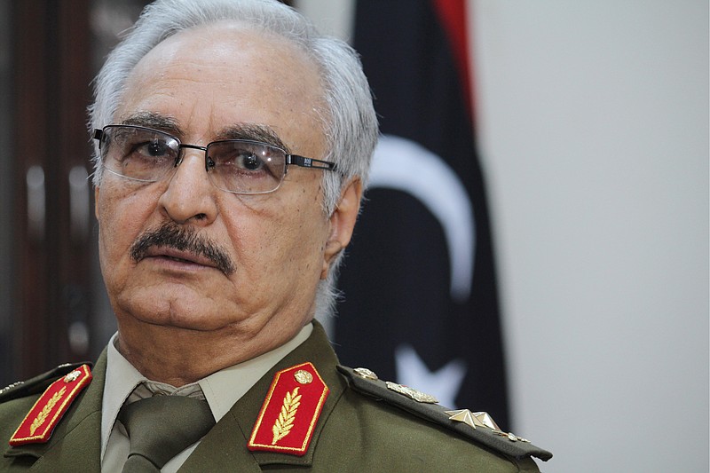 
              FILE -- In this March 18, 2015 photo file photo, Gen. Khalifa Hifter speaks during an interview with The Associated Press, in al-Marj, Libya. Hifter, a powerful Libyan general whose forces recently captured several key oil facilities has rejected a U.N.-brokered government and said the country would be better served by a leader with “high-level military experience.” In a series of written responses to questions from The Associated Press this week, Hifter said his army only recognizes the authority of the Libyan parliament based in the east, which has also rejected the U.N.-backed government in the capital, Tripoli. (AP Photo/Mohammed El-Sheikhy, File)
            