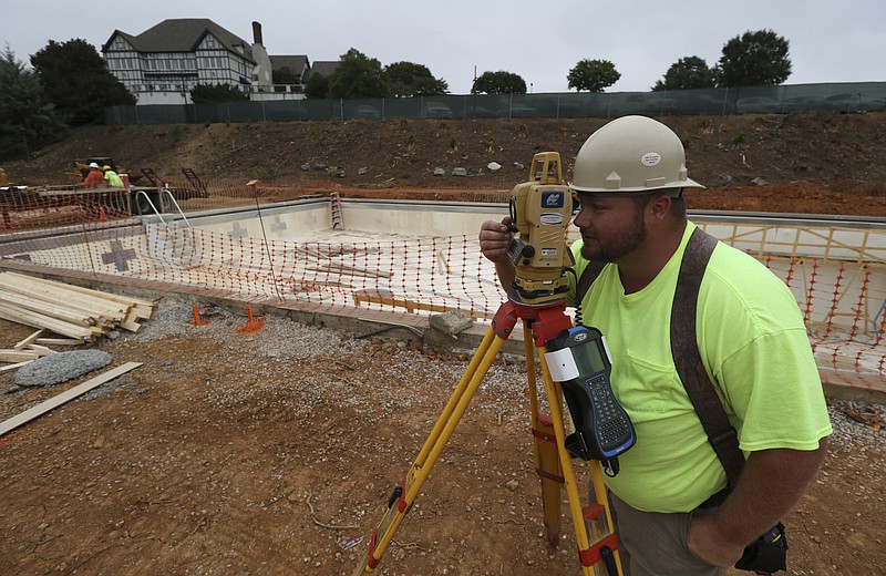 Staff Photo by Dan Henry / The Chattanooga Times Free Press- 9/27/16. Brandon Smith lays out the pool extension as construction continues at the Chattanooga Golf and Country Club renovation on Tuesday, September 27, 2016. 