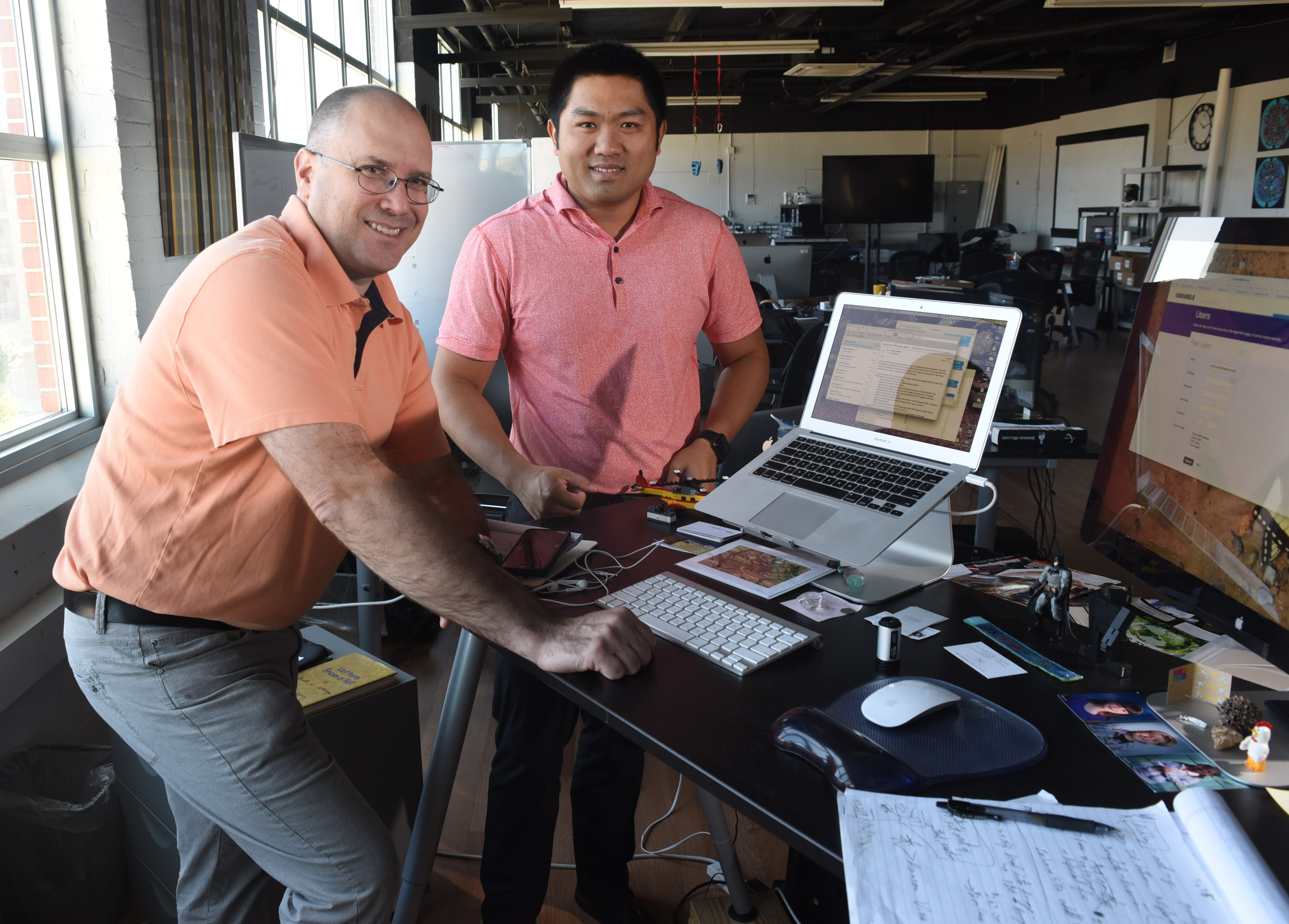 John Kowalski, left, and George Yu stand in the business offices at Variable, Inc., a business in the incubator building on Cherokee Blvd. Yu is founder and CEO of Variable, Inc. Kowalski is vice president of marketing.