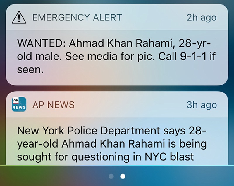 
              FILE - This file frame grab from a cellphone shows an emergency alert along with a news alert on Monday, Sept. 19, 2016, about a man wanted in connection with explosions in the New York City metropolitan area. The federal government is beefing up emergency cellphone alerts like the one used in New York to advertise the search for the bombing suspect. The Federal Communications Commission approved a measure Thursday, Sept. 29, 2016, that will let messages be up to four times longer than the current 90-character limit, and cellphone companies will have to support Spanish messages under the new rules. The changes will also let officials target messages more narrowly and include links in messages. (AP Photo/File)
            