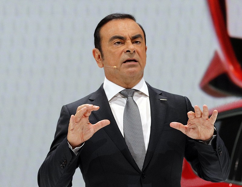 
              Nissan Motor Co. President and CEO Carlos Ghosn addresses the media during the presentation of the Nissan Micra as part of the first press day at the Paris Auto Show in Paris, France, Thursday, Sept. 29, 2016. The Paris Auto Show will open its gates to the public from Oct. 1st to 16th. (AP Photo/Christophe Ena)
            