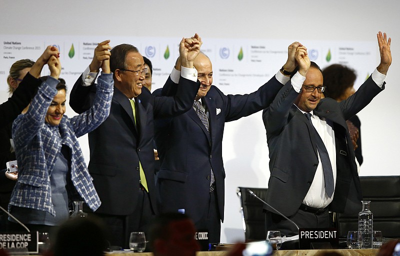 
              FILE - In this Dec. 12, 2015, file photo, French President Francois Hollande, right, French Foreign Minister and president of the COP21 Laurent Fabius, second right, United Nations climate chief Christiana Figueres, left, and United Nations Secretary General Ban Ki-moon hold their hands up in celebration after the final conference at the COP21, the United Nations conference on climate change, in Le Bourget, north of Paris. A team of top scientists are telling world leaders to stop congratulating themselves for a Paris agreement to fight climate change because if more isn’t done the world will likely hit the agreed-upon dangerous warming level in about 35 years.  (AP Photo/Francois Mori, File)
            