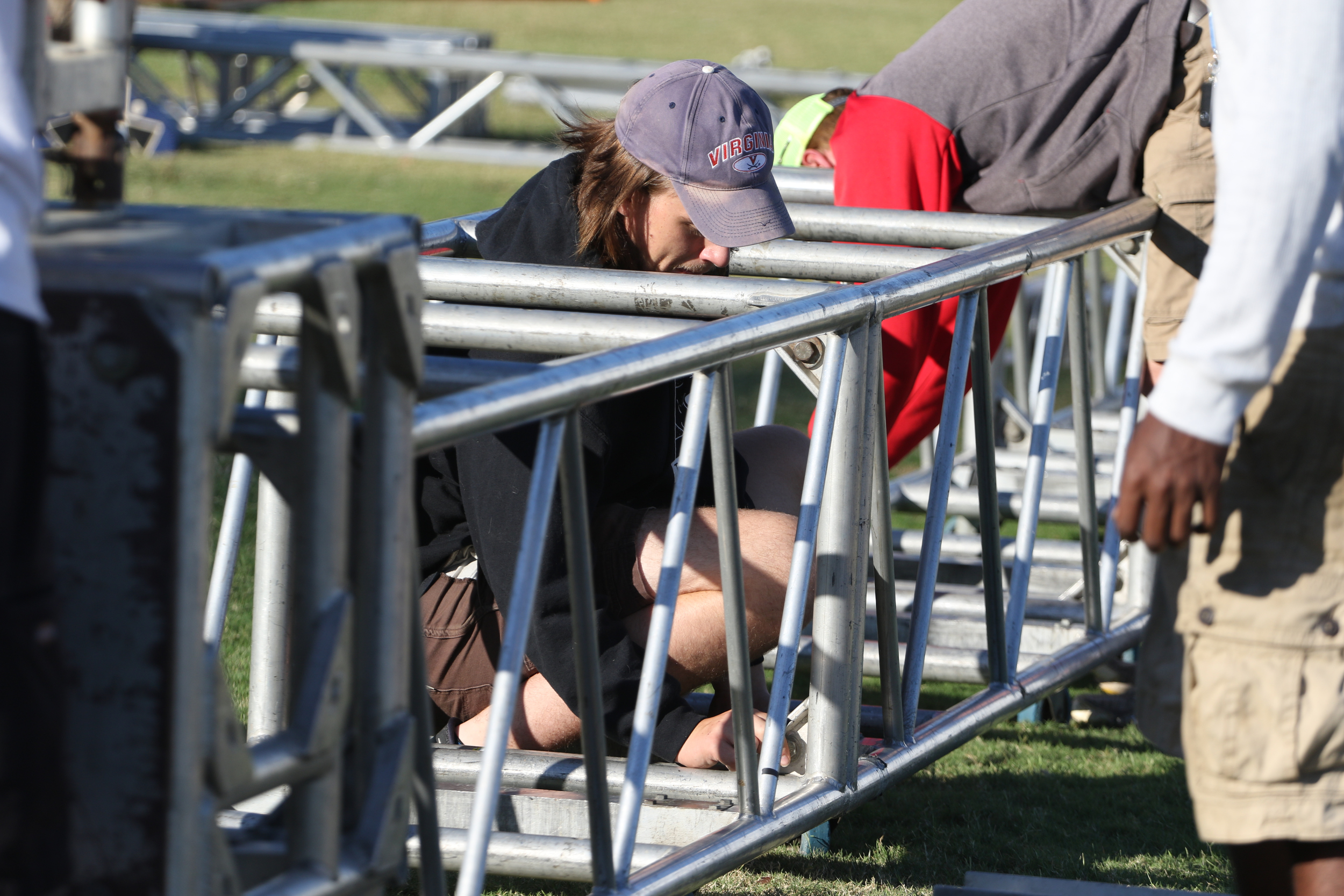 Staff Photo by Dan Henry / The Chattanooga Times Free Press- 9/29/16. Phillip Amos and other workers with the American Stage Company, set up a 60'x20' stage on Thursday, September 29, 2016, along the riverfront in preparation for this weekend's 10th annual 3 Sisters Bluegrass Festival.