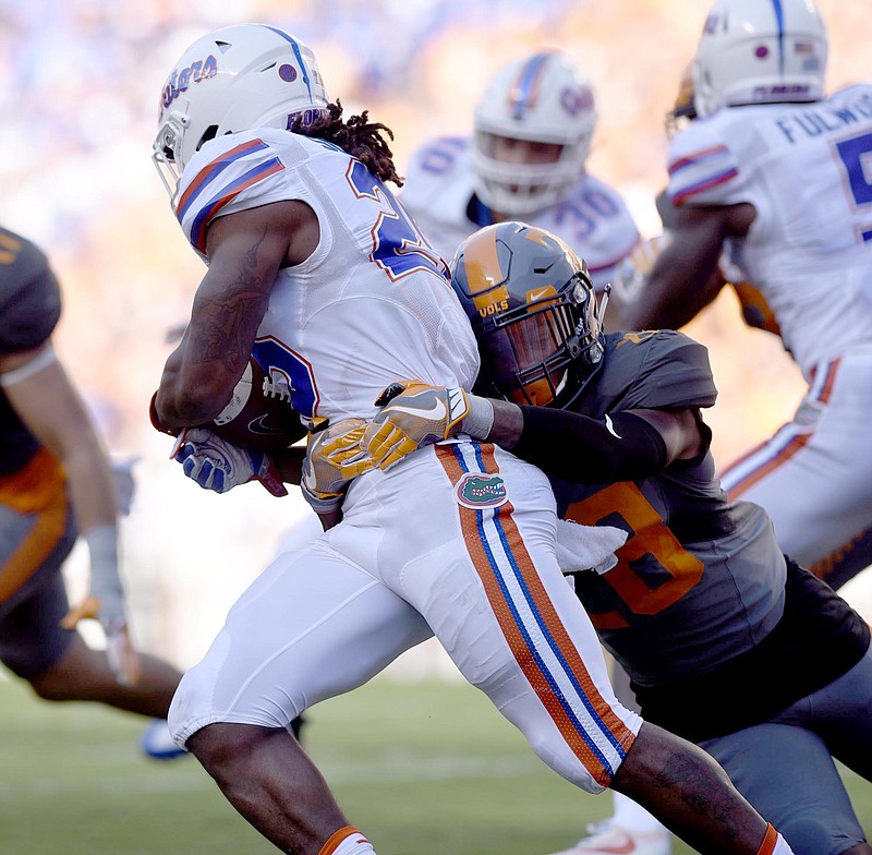 DB Baylen Buchanan (28) tackles a Florida runner.  The Florida Gators visited the Tennessee Volunteers in a important SEC football contest at Neyland Stadium on September 24, 2016.