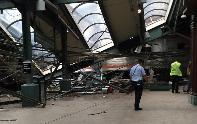
              This Thursday, Sept. 29, 2016 photo provided by a passenger who was on the train when it crashed shows wreckage at the Hoboken, N.J. rail station. The commuter train barreled into the station during the morning rush hour, coming to a halt in a covered area between the station's indoor waiting area and the platform. (AP Photo)
            