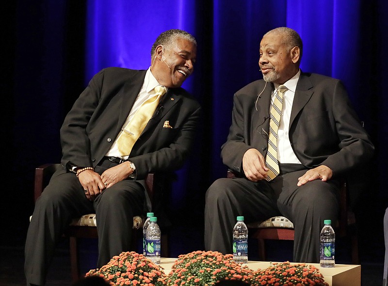 
              In this Sept. 27, 2016 photo, Godfrey Dillard, left, and Perry Wallace take part in a lecture at Vanderbilt University in Nashville, Tenn. A half-century after Wallace became the first black basketball player in the Southeastern conference, he and former teammate Dillard, returned to the campus as part of a campus-wide discussion on race this year at the elite, private southern university. It’s a significant milestone in what has been Vanderbilt’s long, sometimes painful journey to become more diverse.  (AP Photo/Mark Humphrey)
            
