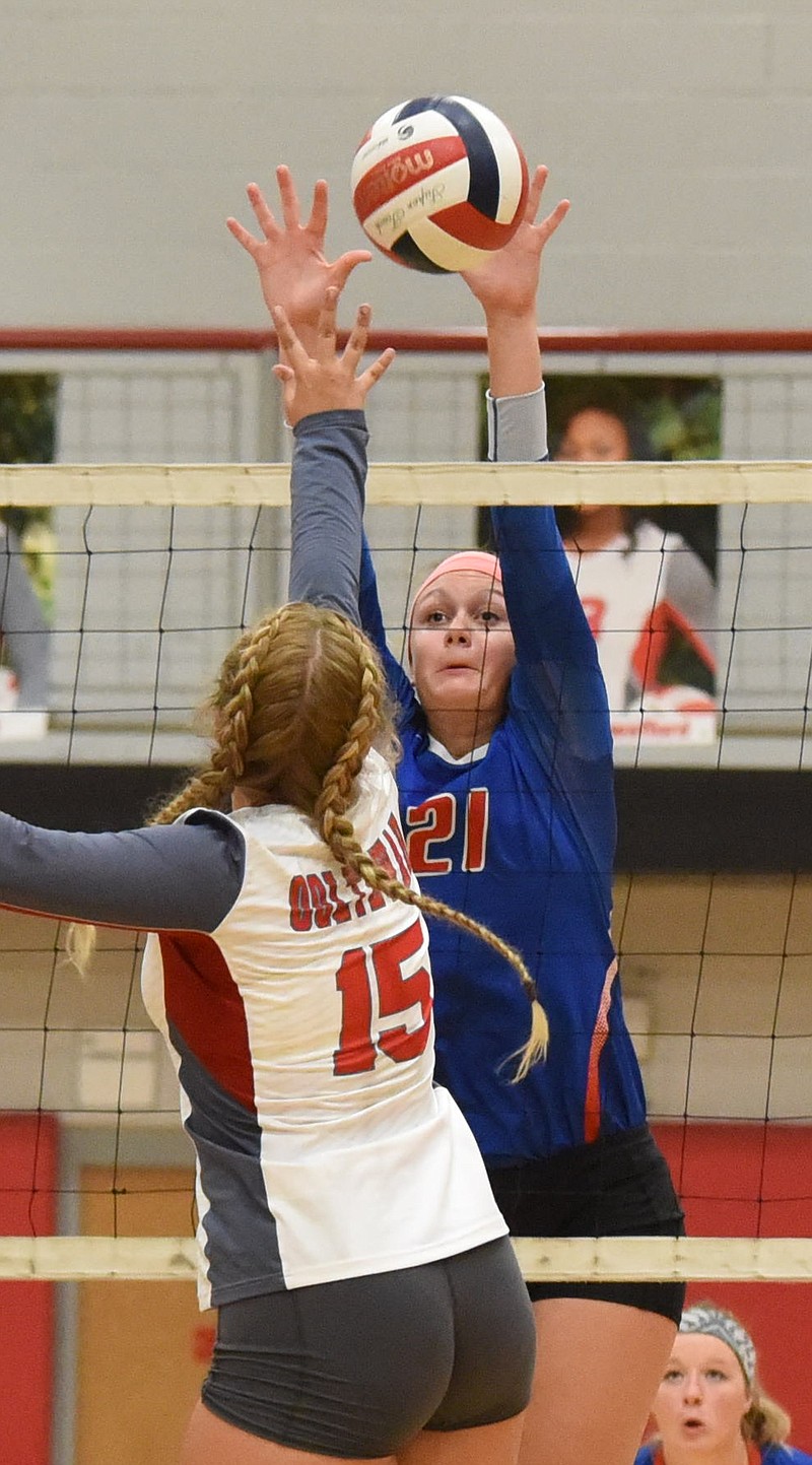 Emma Flowers (21) has been the leader at the net this season for Cleveland High School, which is the top-seeded team in the District 5-AAA volleyball tournament.