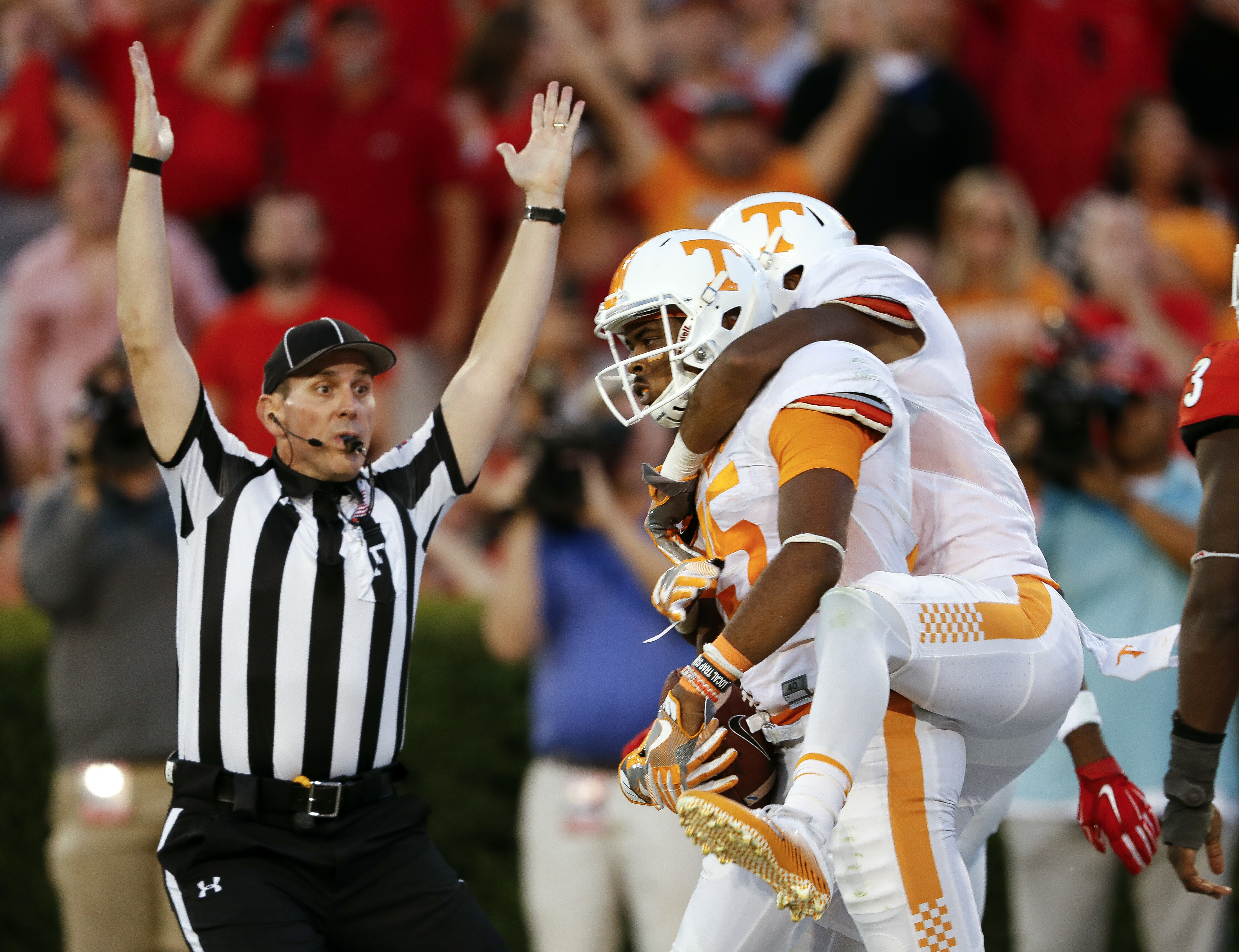 Tennessee wide receiver Jauan Jennings (15) celebrates with Tennessee wide receiver Josh Malone (3) after making a last-second touchdown catch to defeat Georgia 34-31 in an NCAA college football game Saturday, Oct. 1, 2016, in Athens, Ga. (AP Photo/John Bazemore)