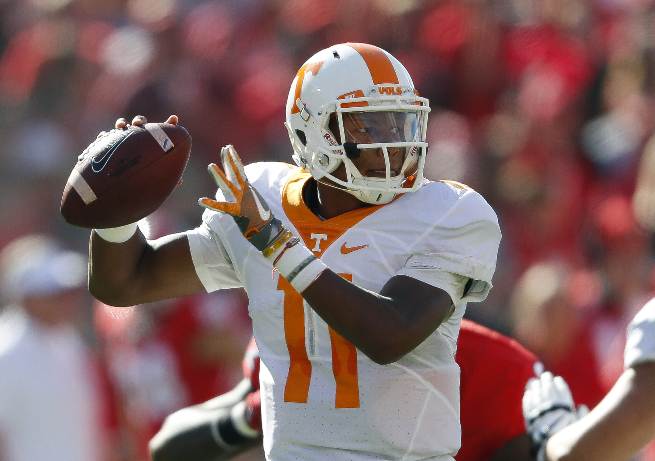 Tennessee quarterback Joshua Dobbs (11) throws from the pocket in the first half of an NCAA college football game against Georgia Saturday, Oct. 1, 2016, in Athens, Ga. (AP Photo/John Bazemore)