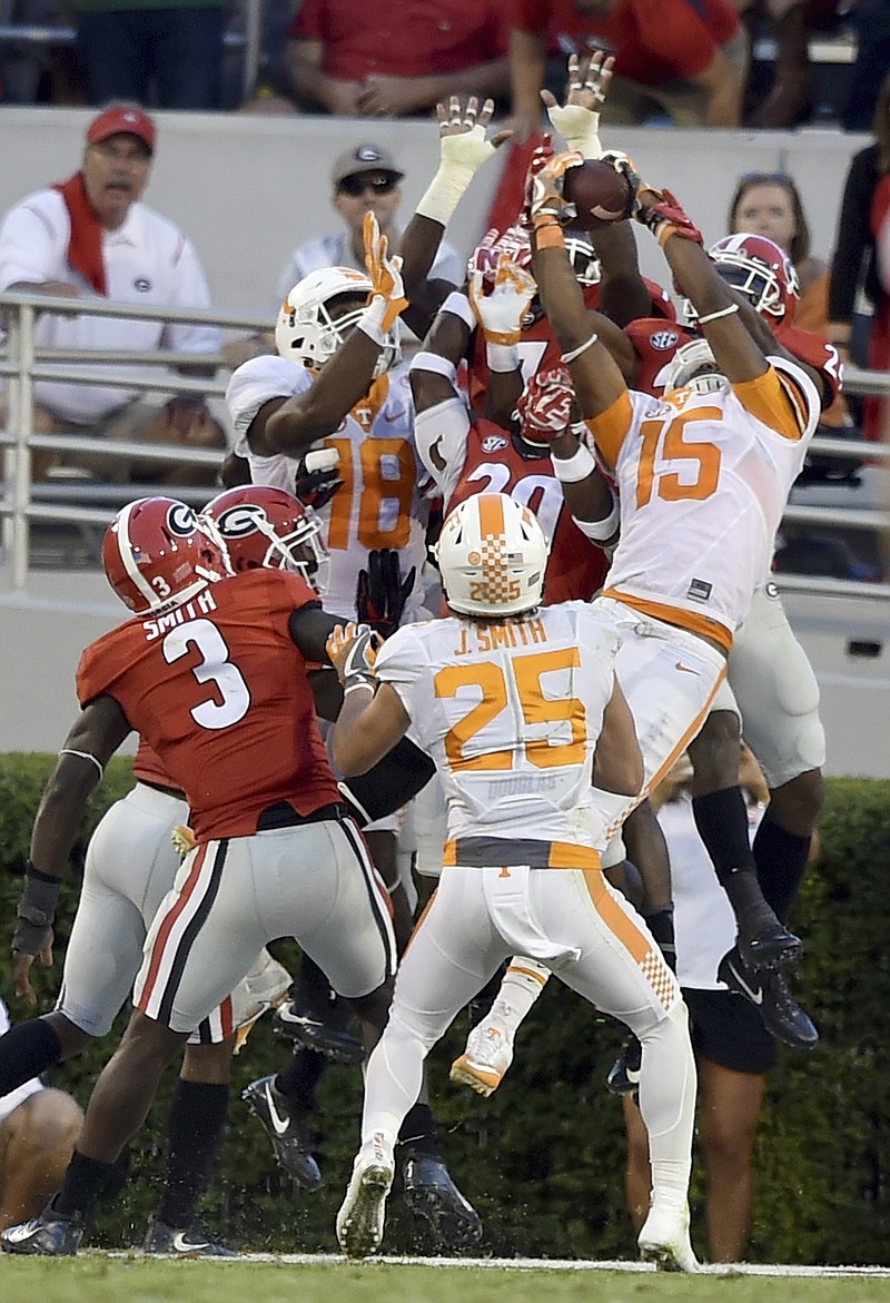 Tennessee wide receiver Jauan Jennings (15) leaps in front of Georgia safety Dominick Sanders for the game winning touchdown as time expires during an NCAA college football game, Saturday, Oct. 1, 2016 in Athens, Ga. (Brant Sanderlin/Atlanta Journal-Constitution via AP)