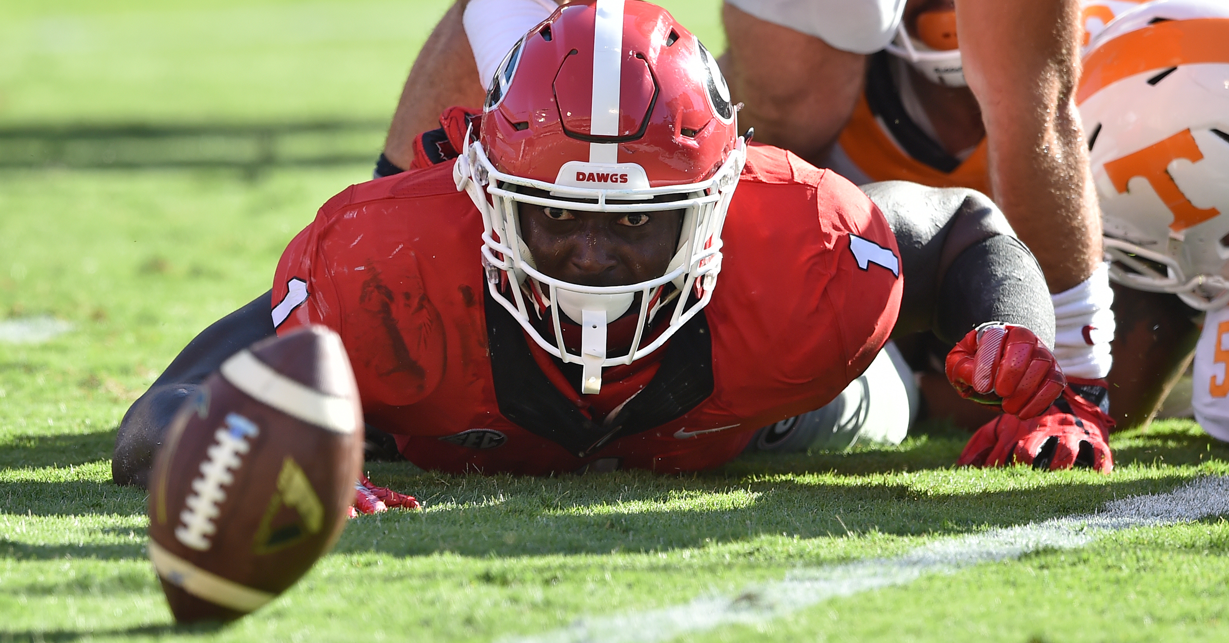 Georgia running back Sony Michel watches his fumble teeter on the goal line before quarterback Jacob Eason recovered if for a touchdown against the Tennessee Volunteers during an NCAA college football game Saturday, Oct. 1, 2016, in Ga. (Brant Sanderlin/Atlanta Journal-Constitution via AP)