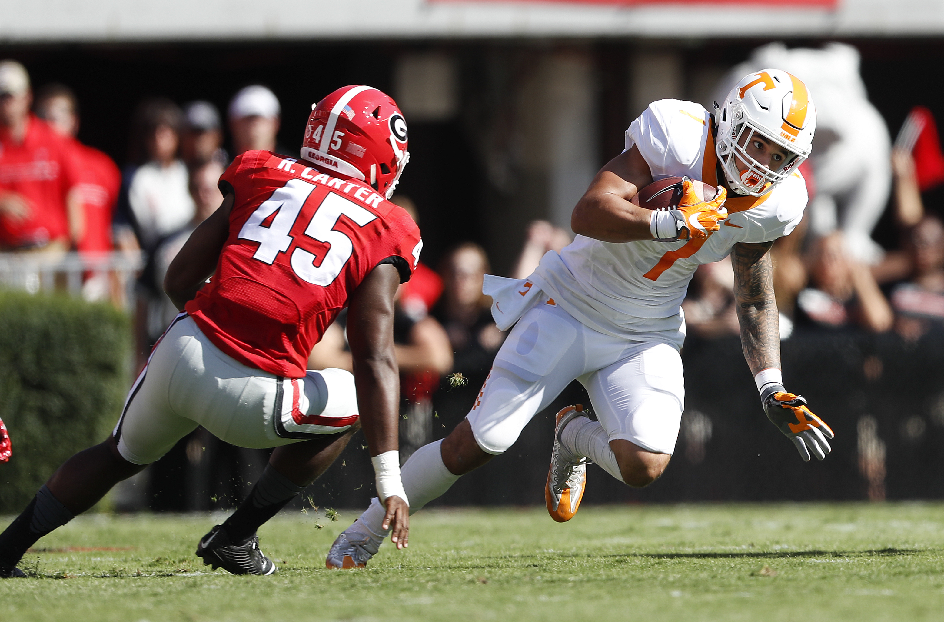 Tennessee running back Jalen Hurd (1) looks for running room as Georgia linebacker Reggie Carter (45) defends in the first half of an NCAA college football game Saturday, Oct. 1, 2016, in Athens, Ga. (AP Photo/John Bazemore)