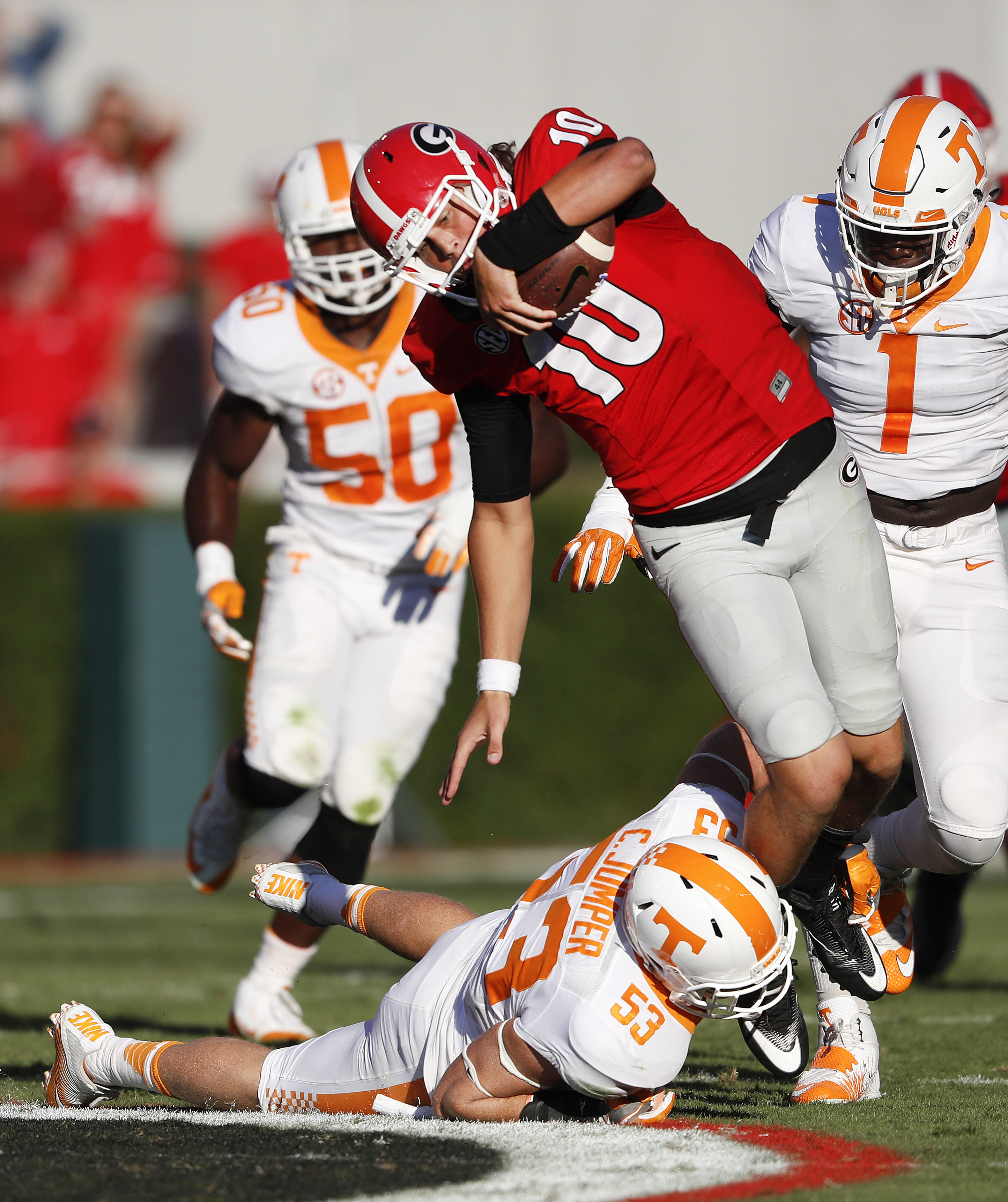 Georgia quarterback Jacob Eason (10) is brought down by Tennessee linebacker Colton Jumper (53) after a short gain in the second half of an NCAA college football game Saturday, Oct. 1, 2016, in Athens, Ga. Tennessee won 34-31. (AP Photo/John Bazemore)