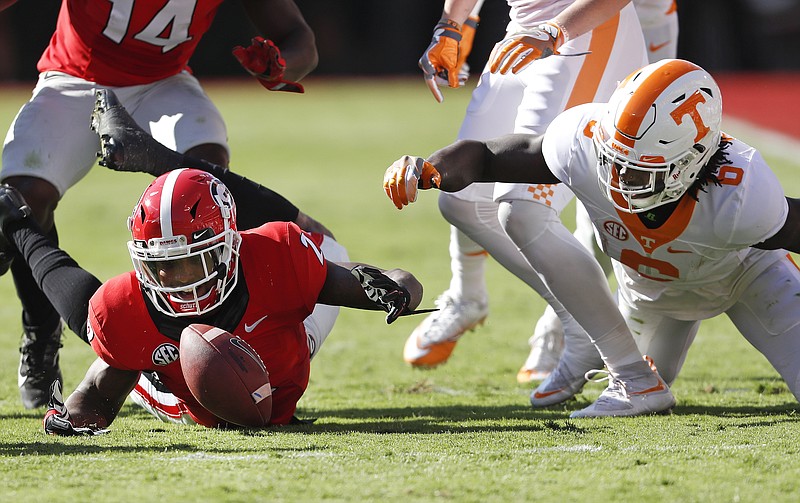 Georgia defensive back Maurice Smith (2) recovers the ball after Tennessee running back Alvin Kamara (6) fumbled it in the first half of an NCAA college football game Saturday, Oct. 1, 2016, in Athens, Ga. (AP Photo/John Bazemore)