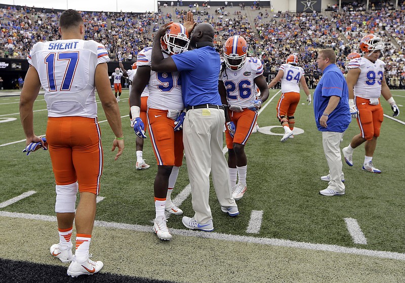 Florida players celebrate after a Vanderbilt pass was intercepted in the second half of an NCAA college football game Saturday, Oct. 1, 2016, in Nashville, Tenn. Florida won 13-6. (AP Photo/Mark Humphrey)