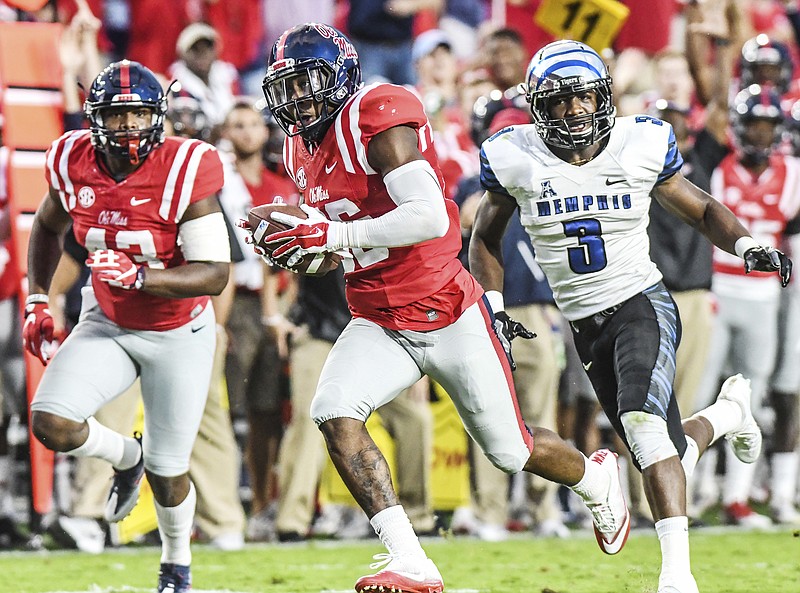 Mississippi defensive back Zedrick Woods (36) intercepts a pass and returns it for a touchdown as Memphis wide receiver Anthony Miller (3) chases during their NCAA college football game against Memphis, Saturday, Oct. 1, 2016, in Oxford, Miss. (Bruce Newman/Oxford Eagle via AP)