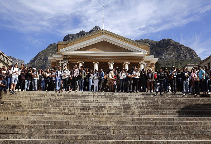 
              FILE - In this file photo dated Tuesday, Sept. 20, 2016, students gather at the University of Cape Town as they protest for free education in Cape Town, South Africa.  Grievances over economic inequities are fueling unrest that has forced the closure of some of South Africa’s most prominent universities, with the government alleging a radical minority has brought campuses to a standstill over financing of higher education.  (AP Photo/Schalk van Zuydam, FILE)
            