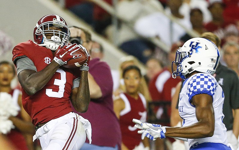 Alabama wide receiver Calvin Ridley makes a catch behind Kentucky defensive back Jordan Griffin during the second half of the Crimson Tide's 34-6 win Saturday night in Tuscaloosa, Ala. Ridley finished with 174 yards on 11 catches, including two touchdowns.