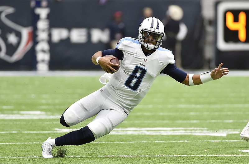 Tennessee Titans quarterback Marcus Mariota (8) runs against the Houston Texans during the first half of an NFL football game, Sunday, Oct. 2, 2016, in Houston. (AP Photo/Eric Christian Smith)