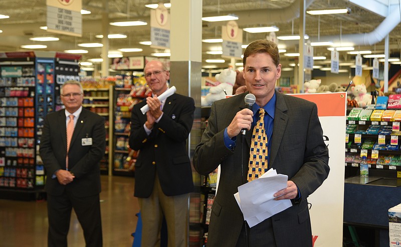 Todd Fortner, TVFCU president and CEO, right, talks Friday, Sept. 23, 2016, at Food City in Red Bank about two new branches of TVFCU that will be opened in the Red Bank and East Hamilton Food City locations as Steve Smith, Food City president and CEO, center, and Mickey Blazer, executive vice president of operations for Food City, left, listen.