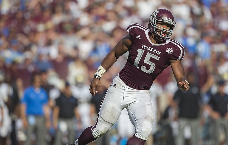 Texas A&M defensive lineman Myles Garrett (15) looks for the ball against UCLA during their Sept. 3 game in College Station, Texas. A&M won 31-24 in overtime and hosts Tennessee this Saturday.