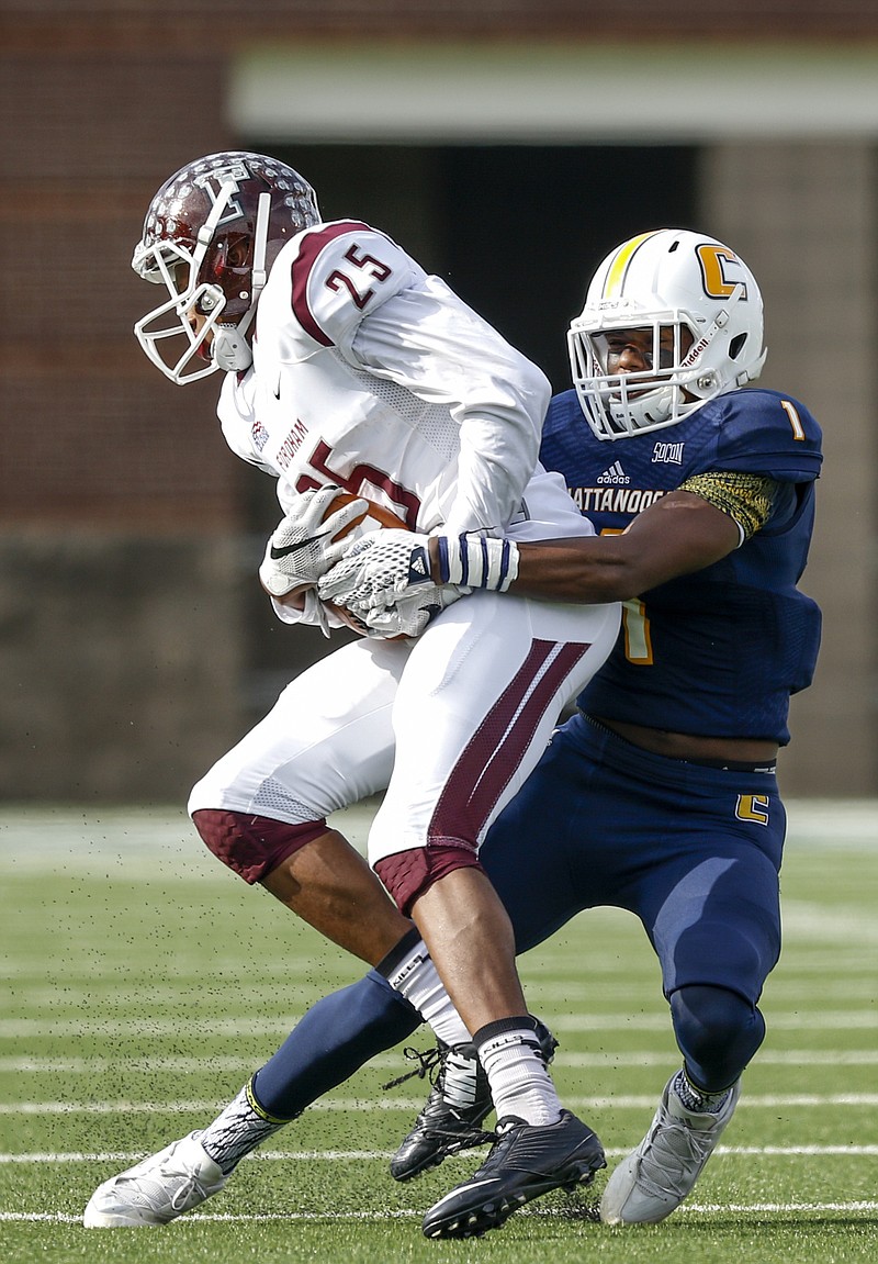 UTC defensive back Trevor Wright, right, tackles Fordham wide receiver Jordan Allen in the first half of their FCS playoff game last Nov. 28 at Finley Stadium. The Mocs won but likely would have had a weaker second-round opponent if not for a loss to Mercer three weeks earlier. Mercer comes to Finley this week.