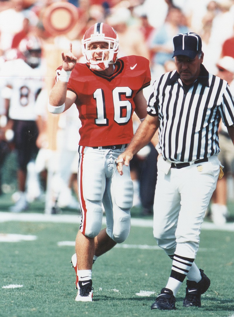 Kirby Smart (16) and Will Muschamp (30) were Georgia safeties during the 1990s, and they will meet as head coaches for the first time Saturday night when Smart's Bulldogs visit Muschamp's South Carolina Gamecocks.