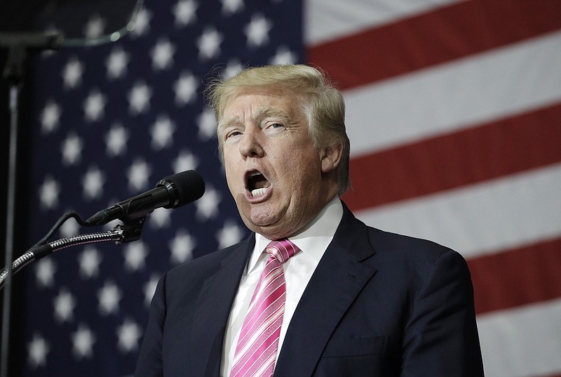 
              Republican presidential candidate Donald Trump speaks at a rally, Saturday, Oct. 1, 2016, in Manheim, Pa. (AP Photo/John Locher)
            