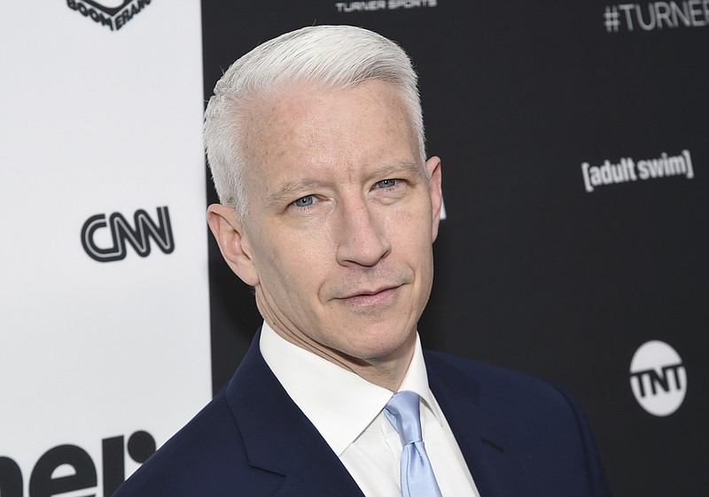 
              FILE - In this May 18, 2016 file photo, CNN news anchor Anderson Cooper attends the Turner Network 2016 Upfronts in New York. Cooper signed a long-term deal to stay with CNN, a person with knowledge of the agreement said Tuesday, Oct. 4. His decision may put an end to the possibility he'll join Kelly Ripa as co-host of ABC's "Live." She reportedly favored him to replace Michael Strahan, who jumped to ABC’s “Good Morning America." (Photo by Evan Agostini/Invision/AP, File)
            