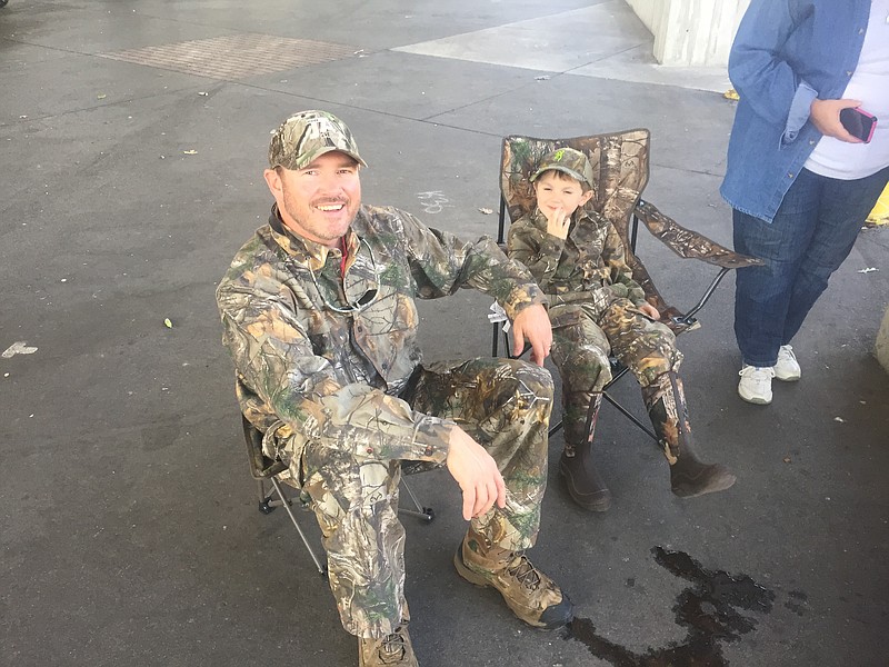 Father and son ????/ and Easton ????? relax before shooting their scenes at First Tennessee Pavilion for Cody McCarver's new video "We Gotta Rise Up."