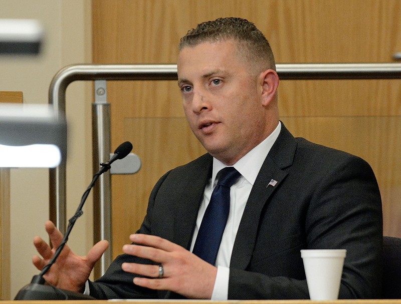 
              Former Albuquerque Police officer Dominique Perez testifies, Tuesday, Oct. 4, 2016 in Albuquerque, N.M. Perez, one of two former police officers standing trial on murder charges in the death of a homeless man took the stand Tuesday to testify in his own defense, marking the first time either officer has spoken publicly about the 2014 shooting that killed 38-year-old James Boyd and derailed the officers' law enforcement careers. (Jim Thompson/The Albuquerque Journal via AP)
            