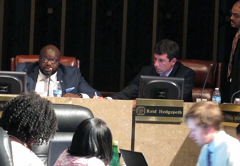 
              Memphis City Council member Berlin Boyd, left, discusses a marijuana-related city ordinance during a council meeting on Tuesday, Oct. 4, 2016 in Memphis, Tenn. Council members Reid Hedgepeth, center, and Edmund Ford, right, also are pictured. (AP Photo/Adrian Sainz)
            